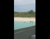 Woman on the ocean hair flip photoshoot