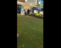 Man black shirt white nike shoes backflip