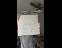 Guy shows house drawing on white paper 