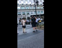 Older guy leans against black railing street