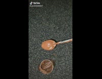 Guy feeds other guy nutella on spoon