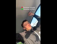 Woman drives while man holds on tightly