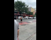 Shirtless man on street fish for change