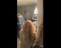 Girl hangs chicken feet lampshade over light in room