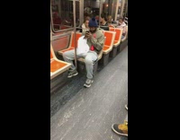 Pt. 2 Guy stares at phone with big wide eyes on subway train