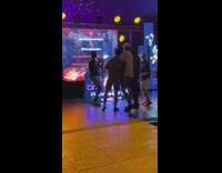 Four men sings in karaoke machine video shoot