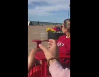 Guy plastic cup falls off red chair