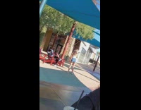 IITW - woman track pants bends down soda in hand