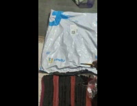 Person opens large plastic packaging for rubiks cube