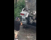 Man takes photo of drawing on truck