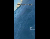 Collab ClipsIG - Lady on Sea Saves Drink from Wave