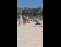 Girl bikini heart pose raise leg beach