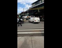 Truck pulls a tripped truck upright on crosswalk
