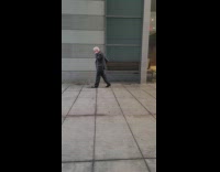 Employee sings loud next to building 