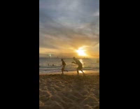 Woman workout outfit runs at the beach