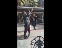 Lady holds up ice cream for photo