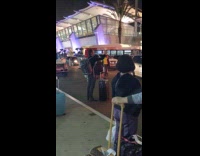 Guy takes selfie outside airport 