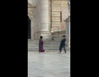 Girl long dress being followed by photographer