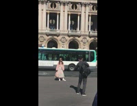 Lady interrupts couple taking photos 