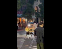 Man films video rides cart with lights