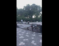 Guy rides rental bicycle at skatepark