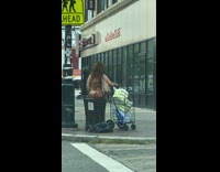 Tiger dress lady sits trash can cart