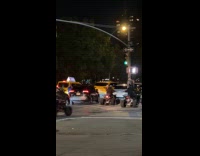 Group drive ATV on sidewalk night traffic