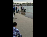Long green dress girl tripod on puddle 