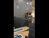 Girl in volleyball uniform sits in trash for picture