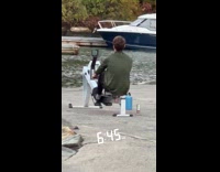 Collab WINY - Man uses row machine at the docks