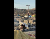 Campground photoshoot jumping long pink jacket