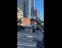 Man white shirt pull ups on stoplight
