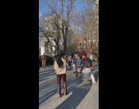 People at park play steel drums together 