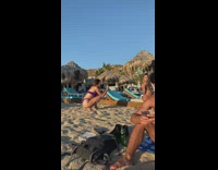 Purple bikini girl blue chair beach sunset 