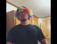 Guy rainbow wig pours beer on face 