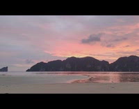 Time lapse sunset beach pink sky rock 