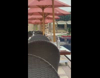 Guy pharaoh wig cross arms umbrella chairs