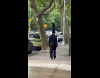 Person wrapped long hair walk on street