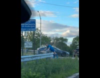 Man blue shirt push ups road fence
