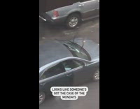 Blue car drives with windshield wipers on