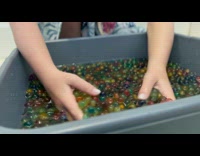 Colorful water beads in the gray container