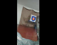 Guy shoots bow and arrow into glass door 