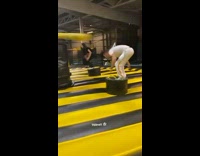 Guy on inflatable spinning obstacle falls fail 