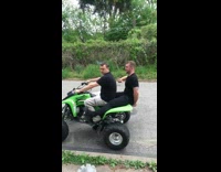 Black shirt guy falls off green ATV