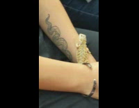Black shirt girl lizard on arm train 