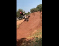 Biker jumps over ramp and falls off bike