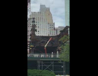 Construction worker works on top of bridge 