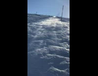 Fog vapor flows down snow mountain girl 