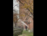 Water sprays out of building 