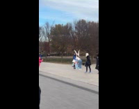 Three women tiktok dance near Lincoln Memorial